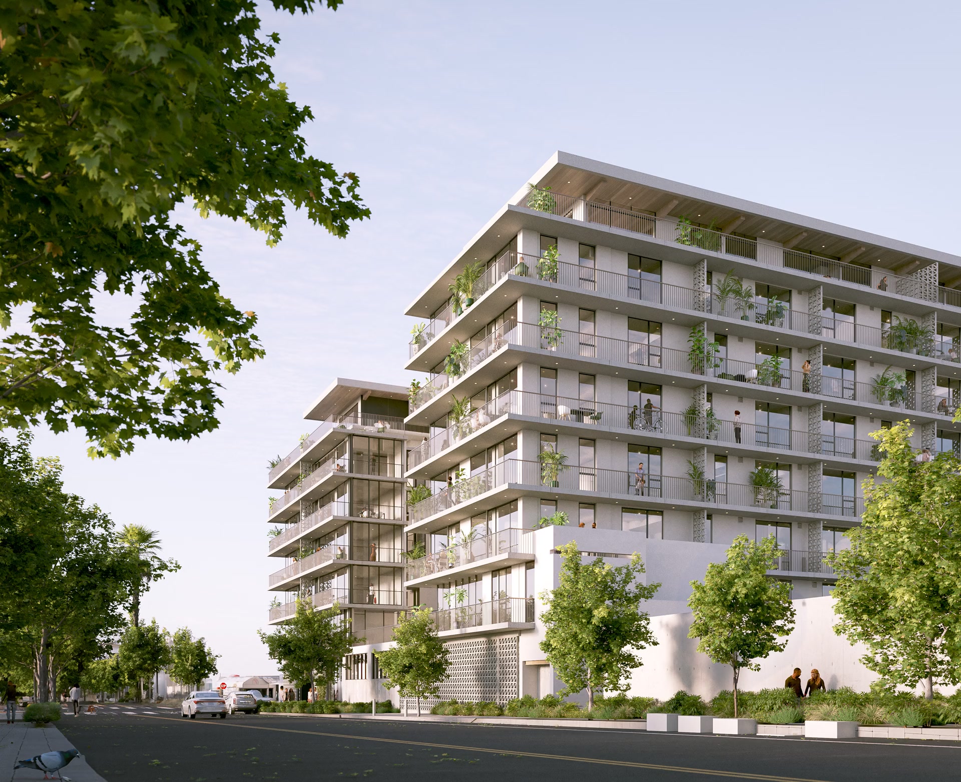 ALÜM exterior rendering viewed through trees, with planted balconies above the street.